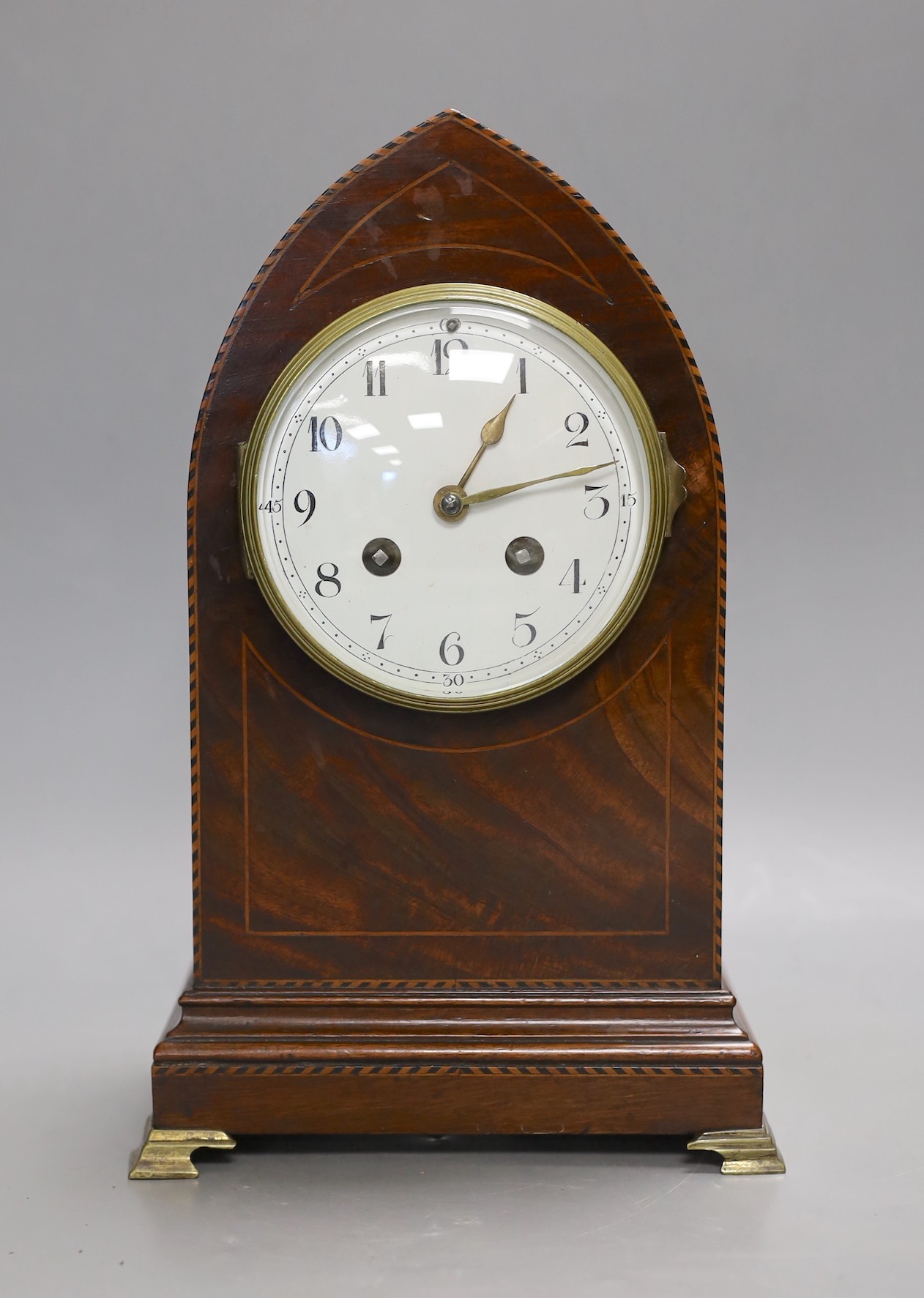 An Edwardian strung mahogany veneered lancet mantel clock, 28.5cm high